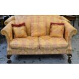 Early to mid 20th Century upholstered hump back sofa in George III style, 77ins wide approximately