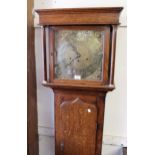 Antique oak longcase clock with a square hood and shaped panel door, the brass dial with a later