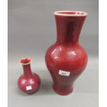 Chinese Sang du Boeuf baluster form vase, 14ins high together with a similar smaller vase, 7ins