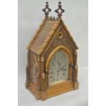 An impressive Victorian Gothic Revival bracket clock, the case modelled in the form of an