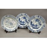 Pair of modern Chinese blue and white plates decorated with figures on a terrace, six character mark