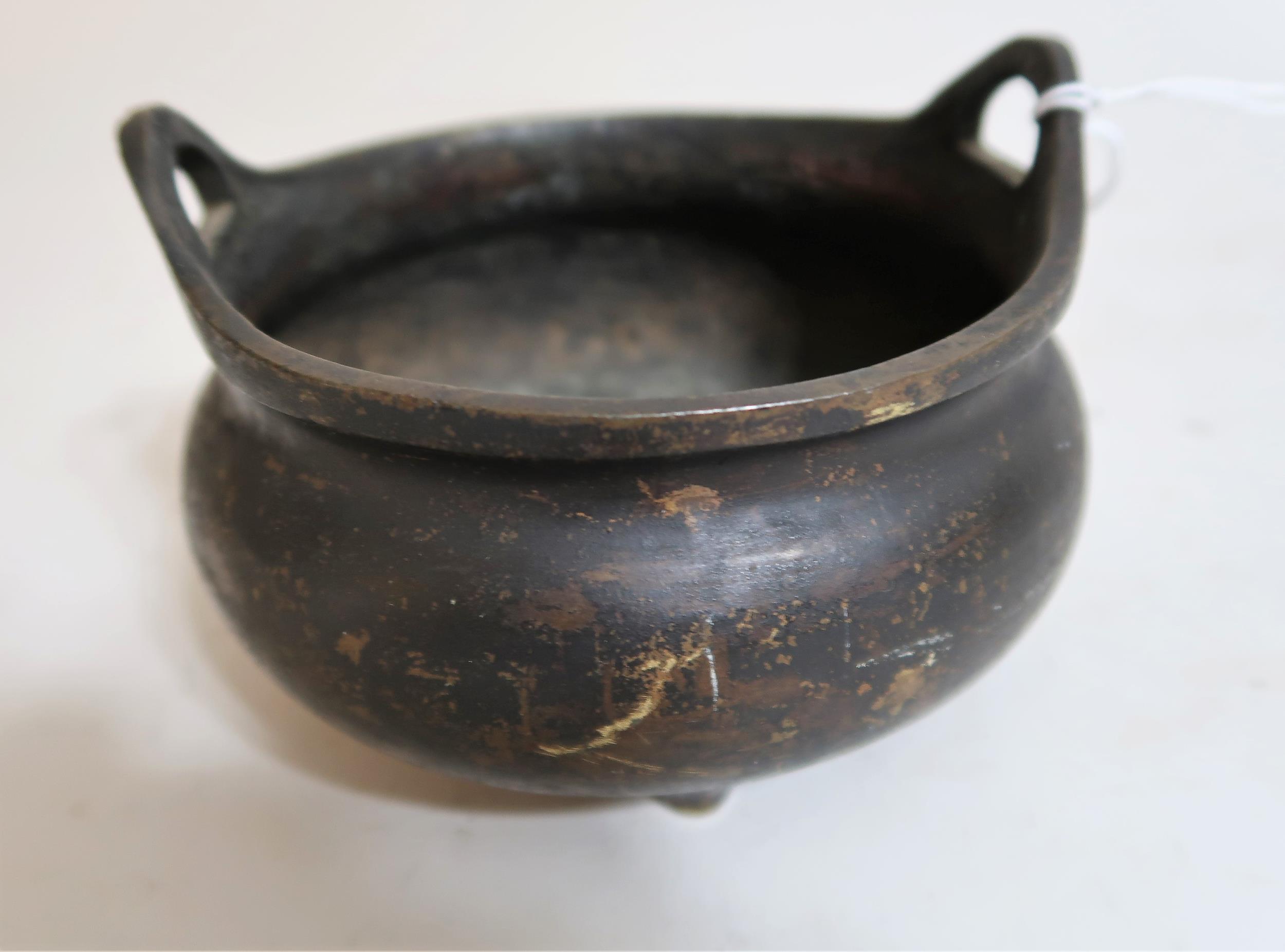 Small Chinese dark patinated bronze two handled censer, seal mark to base, 5ins diameter Crack to