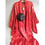 Chinese red silk kimono with embroidered floral decoration, together with a hat