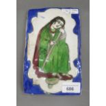 19th Century Qajar tile depicting a seated figure, 7.5ins x 5ins approximately