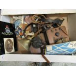 Box containing a collection of various militaria collectables including ARP hand bell, 1916 death