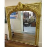 Large good quality 19th Century painted and gilded composition wall mirror, the arched top with a