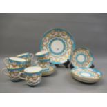 19th Century Mintons part tea service, with floral decoration on a turquoise ground Three cups in