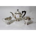 Chinese silver three piece tea service of European octagonal baluster pedestal design, marked '