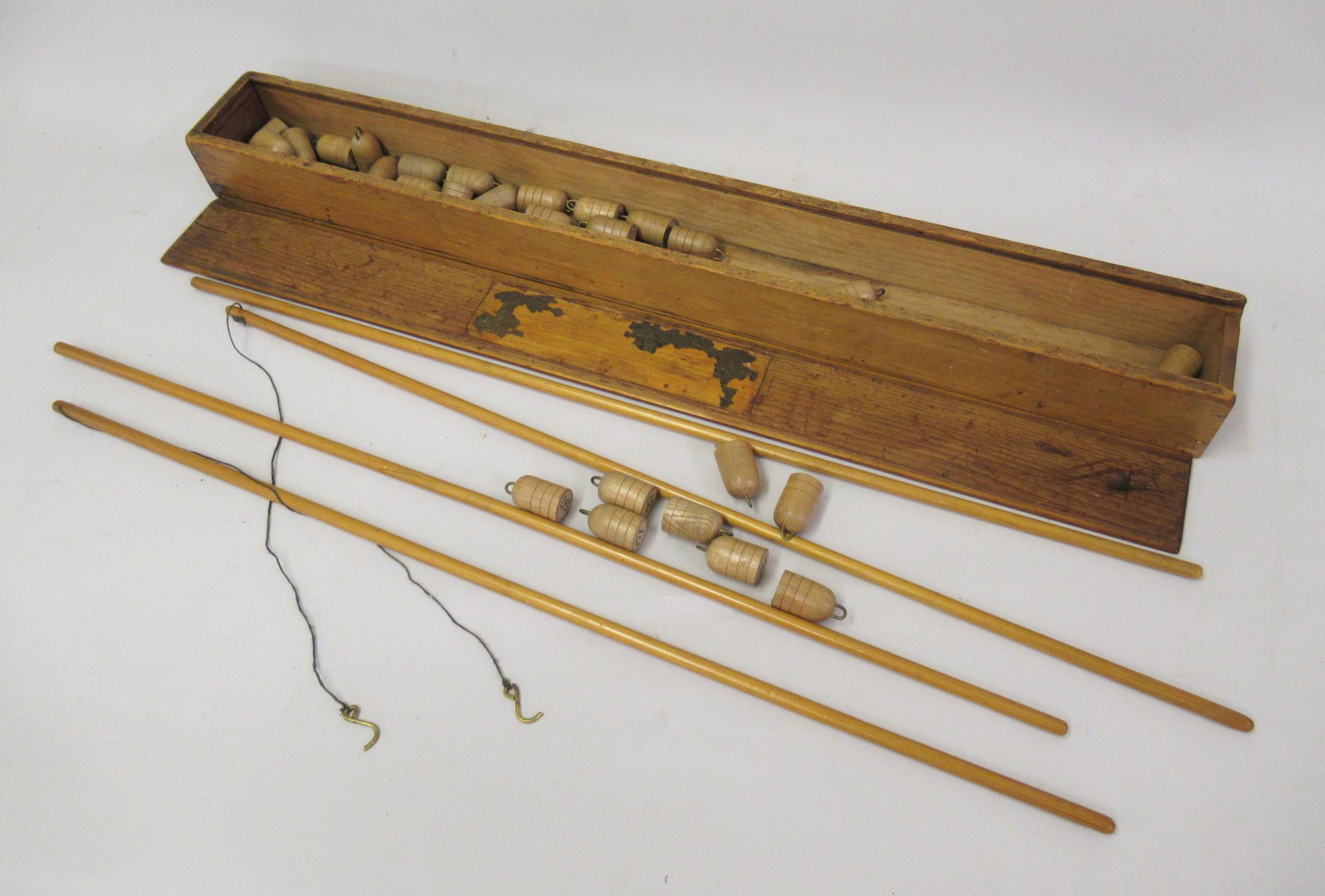 Early 20th Century wooden fishing game in original box, 25.5ins long overall