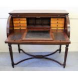 19th Century mahogany tambour desk opening to reveal a fitted interior with pull-out writing surface