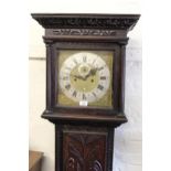 George III oak longcase clock with later carved decoration, the square hood flanked by fluted