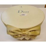 Circular Dior box containing various costume jewellery