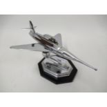 Mid 20th Century chrome plated table lighter in the form of a jet aircraft, on an irregular