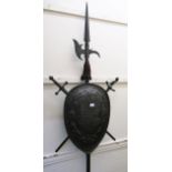 19th Century brown patinated cast iron sword and shield wall plaque, with attached halberd