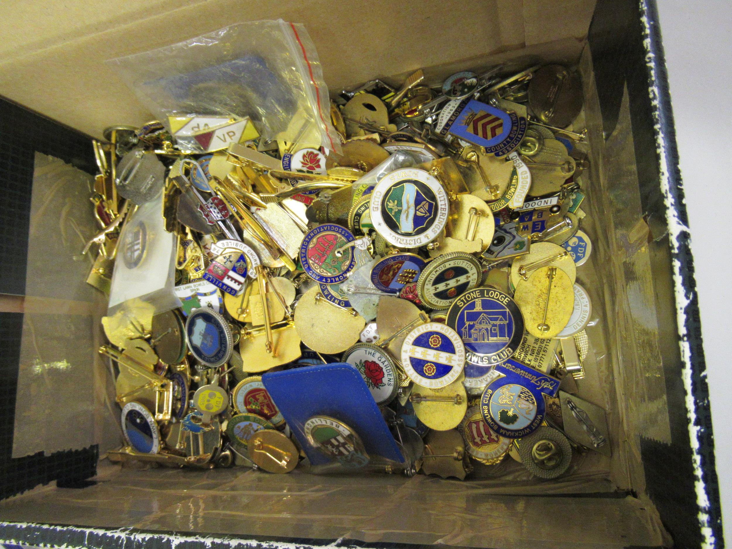 Box containing a large collection of 20th Century enamel badges relating to bowling clubs