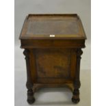 Victorian walnut Davenport with hinged sloping leather inset writing surface enclosing a maple lined