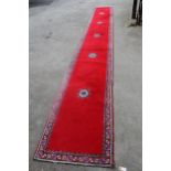 North African woollen runner on wine ground, 21ins x 2ft 8ins approximately Machine made 31ins