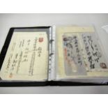 Album containing a collection of Japanese revenue stamps