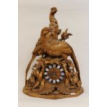 Large 19th Century Black Forest mantel clock, carved with figures of pheasants in foliage, the