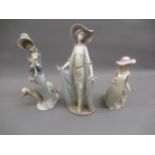 Lladro figure of an elegant lady in a shawl, another of a lady with an Afghan hound and another