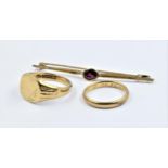 9ct Gold wedding band, together with a 9ct gold signet ring and a 333 mark yellow metal garnet set