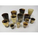 Quantity of antique horn drinking vessels including a collapsable cup, miniature goblet etc.