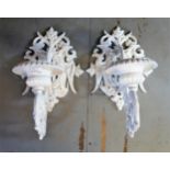 Pair of large white painted cast iron candle wall sconces with pierced armorial style brackets,