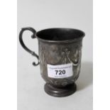 Early 20th Century Sheffield silver Christening mug with embossed swag decoration and scroll handle,