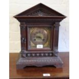 Late 19th Century German oak two train mantel clock with arched top