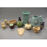 1930's Sylvac pottery jug with squirrel handle, a Sylvac relief moulded pottery vase, three other