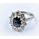 Large 18ct white gold and platinum oval sapphire and diamond cluster ring, the central sapphire