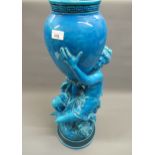 Large 19th Century Minton blue turquoise glazed figural vase in the form of a seated girl supporting