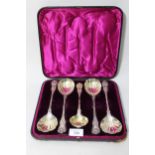 Set of four late Victorian silver fruit spoons with scallop shell bowls and cast handles, London,