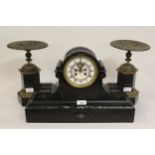 19th Century black slate mantel clock with two train movement and visible escapement, together