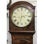 George III mahogany longcase clock, the arched hood above an arched door raised on bracket feet, the