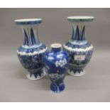Pair of reproduction Chinese blue and white floral decorated baluster form vases 9.5ins high,
