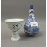 Small Chinese blue and white bottle vase decorated with a landscape, four character mark to base,