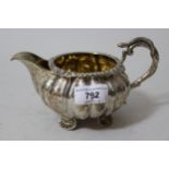 19th Century French silver cream jug of baluster fluted form with a snake pattern handle, marked