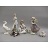 Group of four various Lladro figures with puppies, basket of flowers etc, together with a Chinese