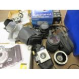 Box containing a quantity of cameras including a Sigma Hoya 52mm Skylight (1B) lens