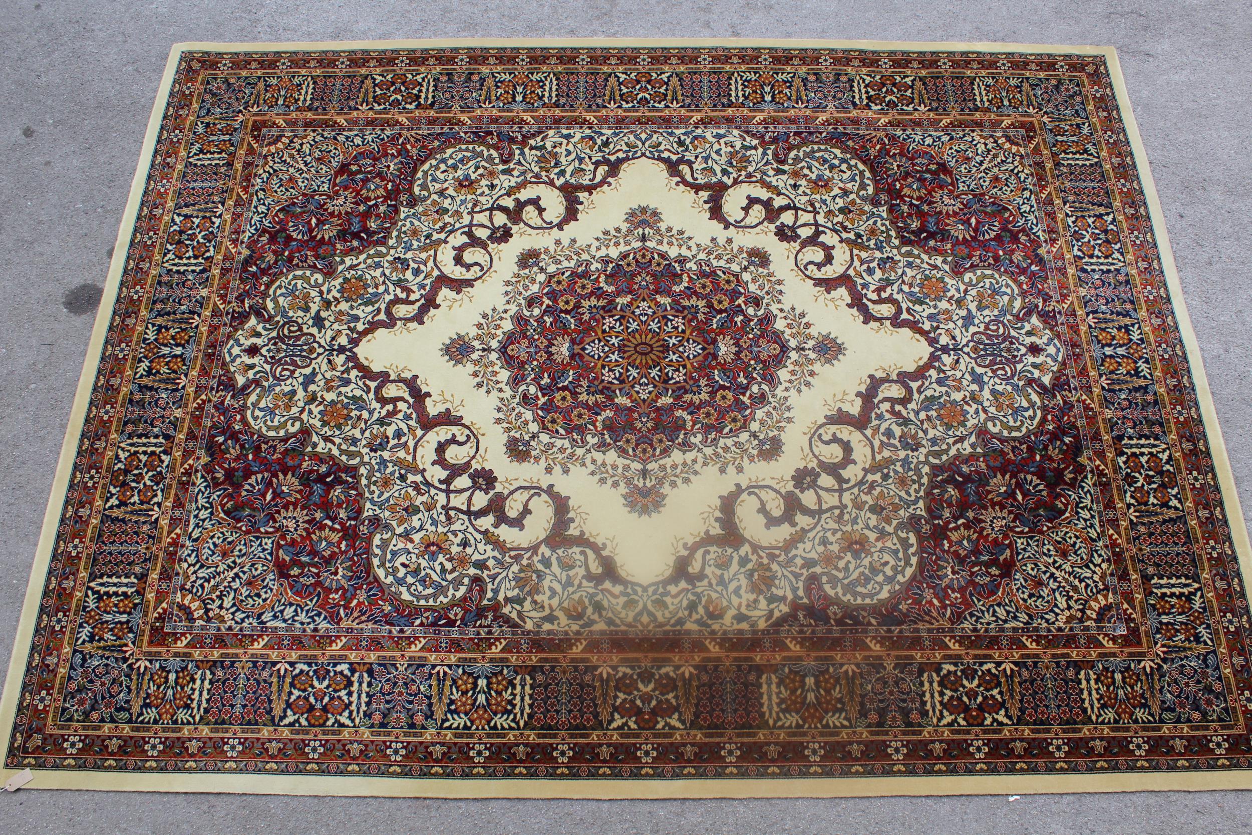 Machine woven Persian design carpet on beige ground, 144ins x 108ins