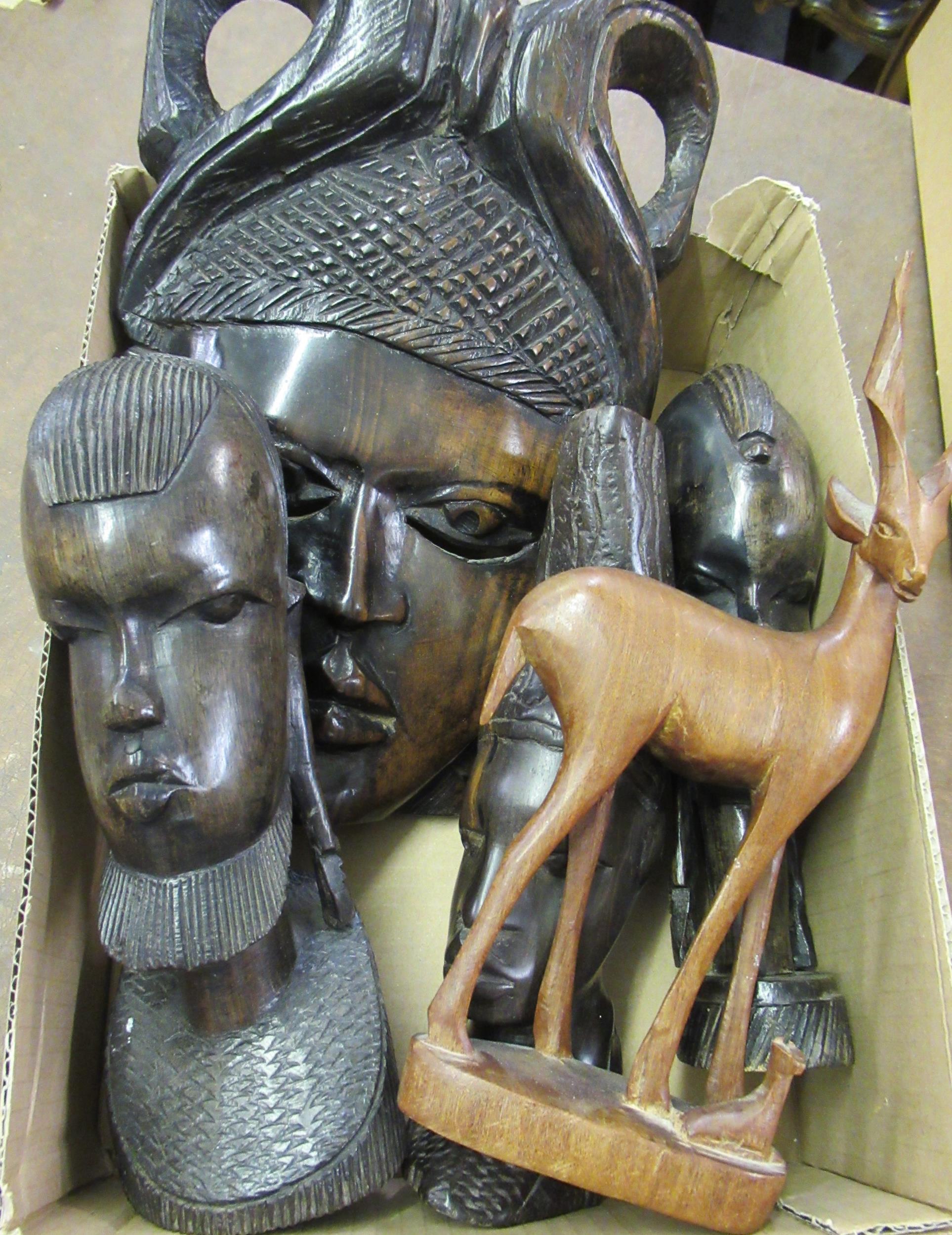 Native African carved hardwood wall mask and a small quantity of other similar figures