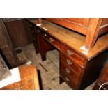 Edwardian mahogany twin pedestal desk, having an arrangement of nine drawers with brass swan neck