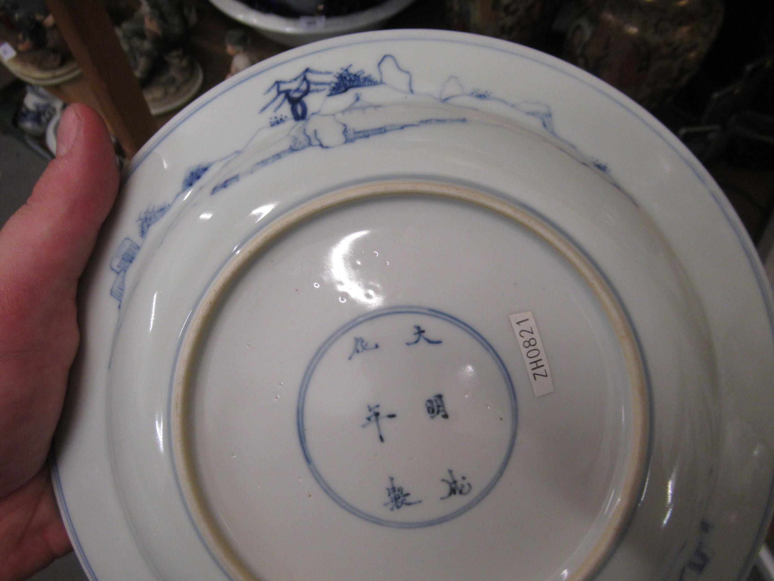 Pair of modern Chinese blue and white plates decorated with figures on a terrace, six character mark - Image 5 of 9