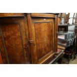 Victorian walnut side cabinet, the moulded top above a central panel door flanked by turned