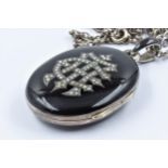 Victorian silver gilt black enamelled double locket bearing monogram, on a silver chain link