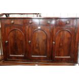 19th Century mahogany sideboard, the shallow figured top above four small frieze drawers and three