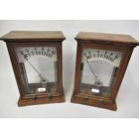 Early 20th Century walnut cased amp meter, 14ins high, together with a matching volt meter