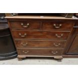 George III mahogany straight front chest, the moulded top above two short and three long graduated