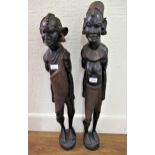 Pair of 20th Century African native carved hardwood standing figures, 35ins high approximately